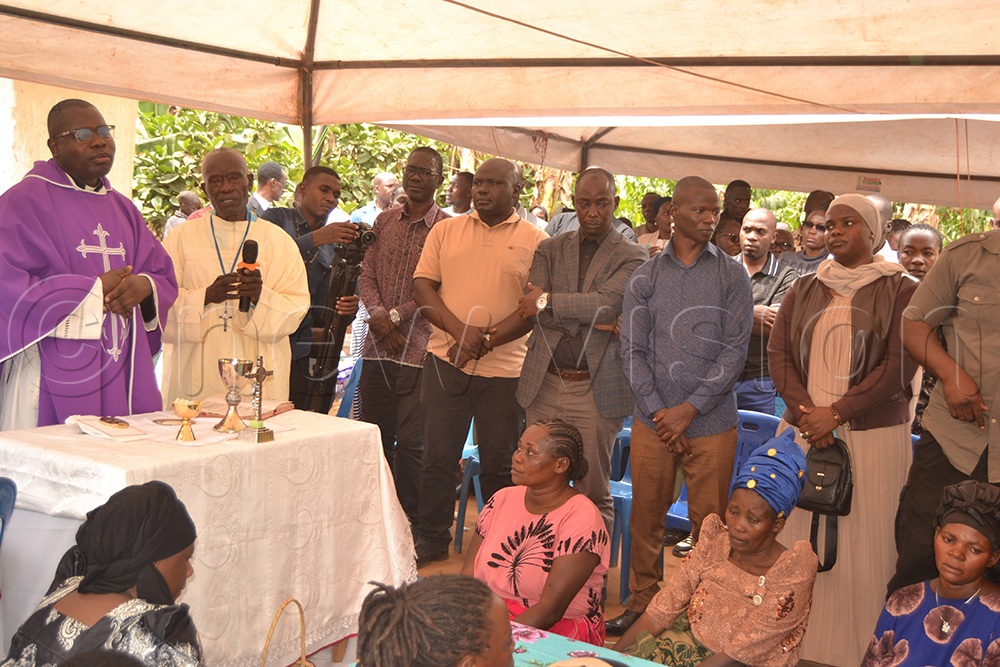 Rev. Fr. Mark Ssemayengo leading prayers during the send-off of Tamale. (Photo by Margret Zalwango)