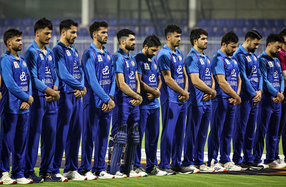 Afghanistan's players observe a minute of silence for earthquake victims before the start of their T20 international cricket match against the United Arab Emirates in Sharjah on September 1, 2025. (Photo by FADEL SENNA / AFP)