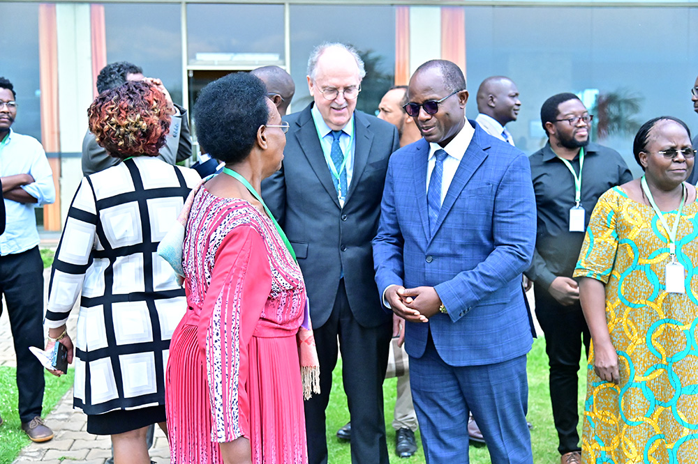 State Minister for Agriculture Maj Fred Bwino Kyakulaga (second right, in a blue suit) with Joachim von Braun of the Center for Development Research at the University of Bonn on the sidelines of an international food security workshop. (Courtesy photo)