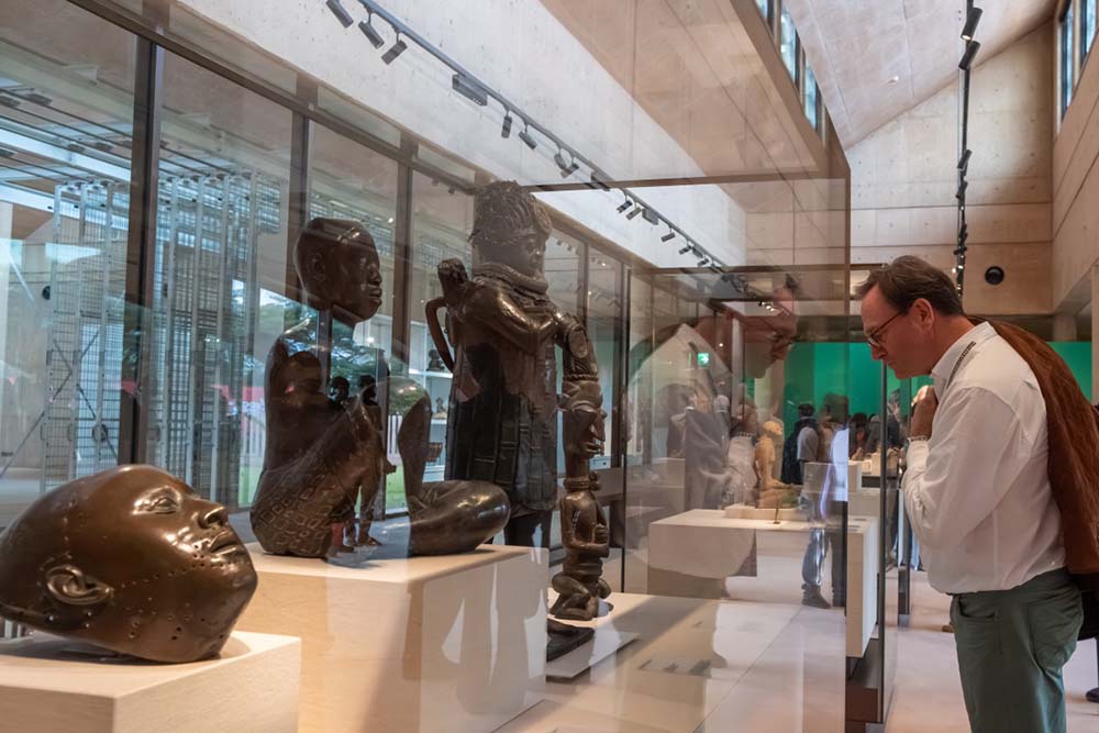 Guests view artworks at the opening of the Imaginary Exhibition: Homecoming at the Museum of West African Art (MOWAA) in Benin City, Edo State, Nigeria, on November 9, 2025. (Credit: AFP)