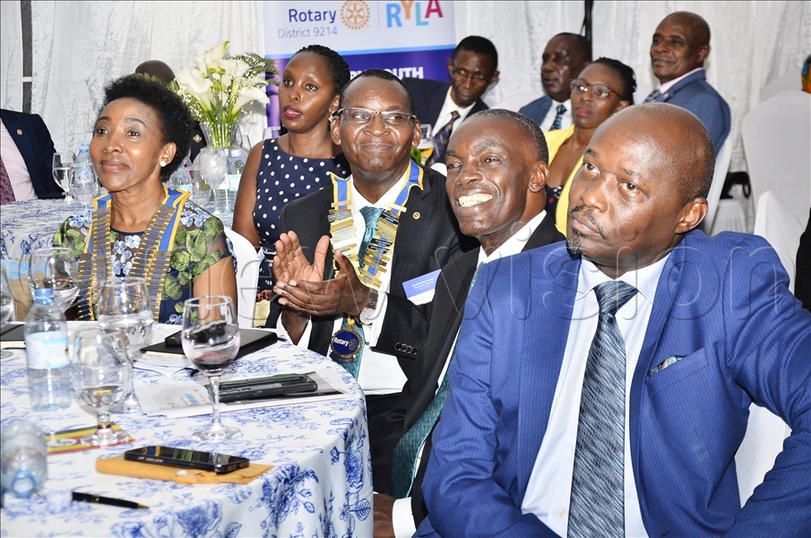 The Rotary District 9214 Governor, Christine Kyeyune Kawooya (left), the President of the Rotary Club of Muyenga, Alex Bwomeezi Mugume (second left), the assistant Governor of Rotary Club of Kajjansi, Alex Kamukama (second right) and the Past District Governor, Kenneth Mugisha (right) listen to contributions from members during the Rotary District 9214 Governor's visit to Rotary Club of Muyenga at Muyenga, Kampala on October 22. (Credit: Ronnie Kijjambu)