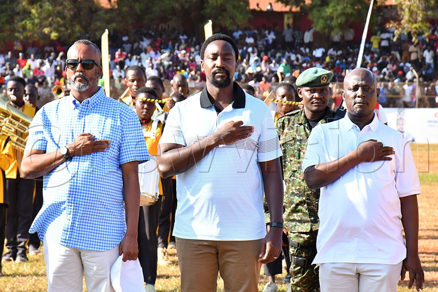 From L-R: Busoga Kingdom's 2nd Deputy Prime Minister Alhaj Asman Ahmed Noor, Kyabazinga of Busoga William Gabula Nadiope IV, Busoga Kingdom's 1st Deputy Prime Minister Prof. Dr. Muhamadi Lubega Kisambira, singing the Busoga Anthem before start of the MTN-Busoga Masaza Cup final game between Kigulu and Luuka FC at Kyabazinga Stadium in Bugembe . Photo by Donald Kiirya