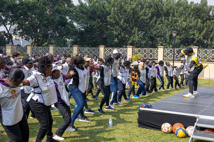 Coach Robert Ssebugwawo, Daphine Ayebare and the Permanent Secretary (PS) and secretary to the judiciary, Dr. Pius Bigirimanzi, demonstrate workout routine to judicial officers. Photo by Richard Sanya 