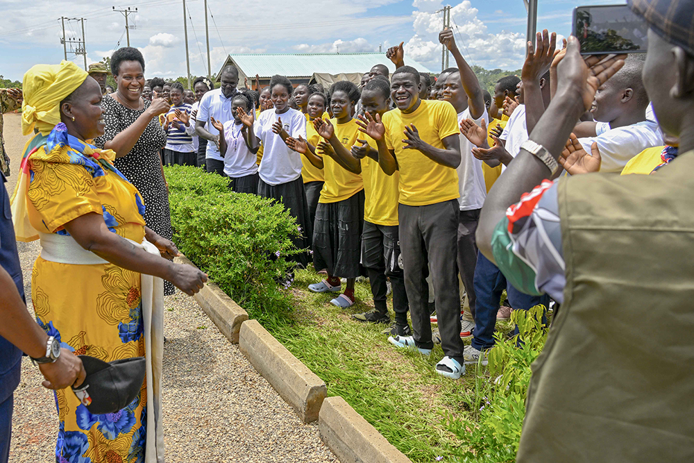 The State House Comptroller Jane Barekye (tsecond left) in the company of Maama Janet (Betty Muhaye)  (left) a mobiliser being welcomed by excited Acholi Zonal Industrial hub students as the comptroller to open the Training of District Industrial Hub Chairpersons, RDC, Commercial officer, PWDs representatives, SACCO chairperson leaders representatives, SACCO leaders from Regional President Industrial hubs of West Nile, Zombo, Lango and Acholi on the Management of the SACCO funds from President Yoweri Kaguta Museveni at Acholi Zonal Industrial hub Gulu City on 19th  October 2025. 