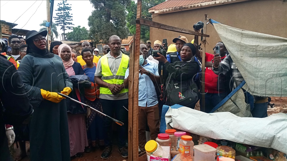 The Executive Director of KCCA, Hajat Sharifah Buzeki (left) addressing shopkeepers during the Weyonje community clean-up exercise at Kawempe Mbogo in Kampala.
