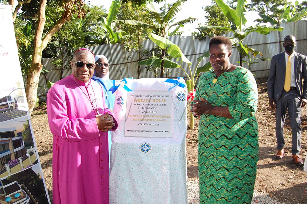 Archbishop Paul Ssemogerere with Vice-President Aluoo at the foundation stone of the proposed priests' house at Mount Sion Prayer Centre Bukalango after unveiling it. (Photo by Mathias Mazinga)