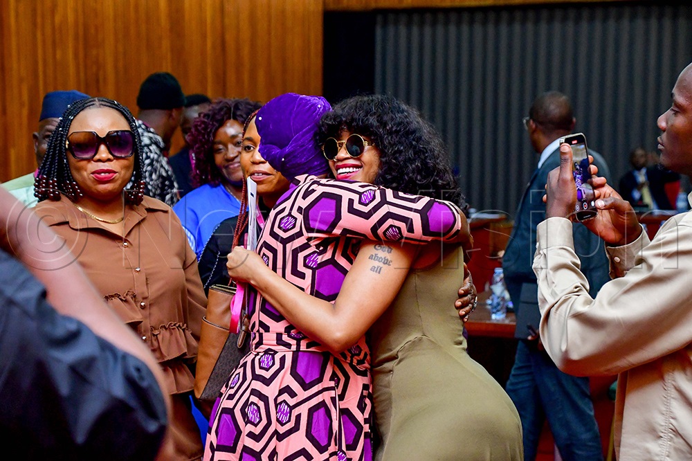 Sheebah Karungi and Halima Namakula embrace each otheer after meeting at Parliament. (Credit: Miriam Namutebi)