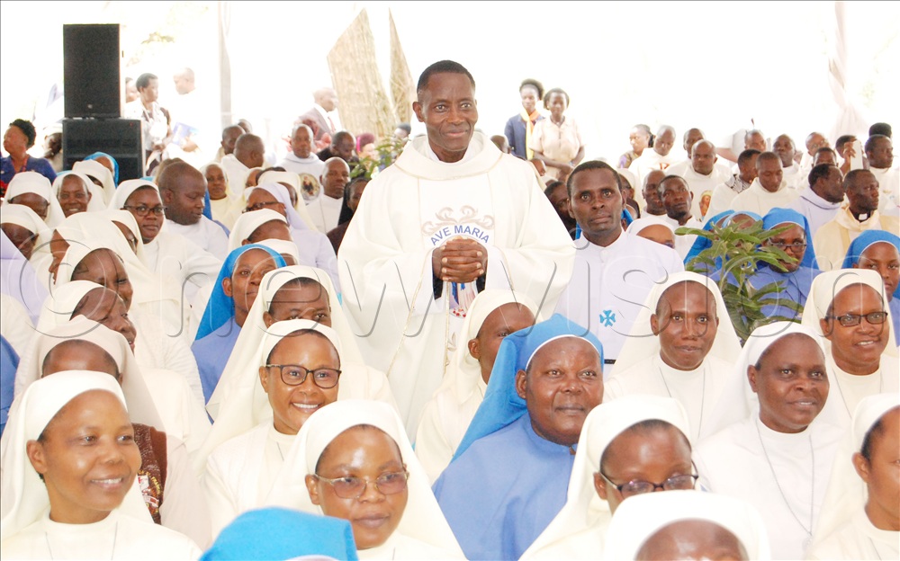 Fr. Emmanuel Tamale shares a photo-moment with the Catholic nuns who graced his silver jubilee function.