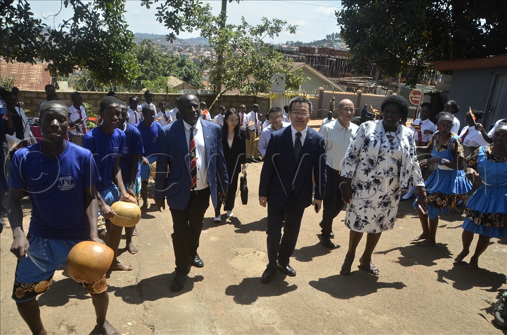 Chinese Ambassador Wu Guangrong, Director of School Prof Charles Ibingira and principal of Crescent School Canon Lydia Kabandize during the culture day