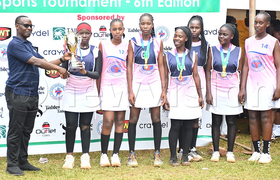 Bethel Convenant College receive the Netball Championship trophy after the Independence tournament. Photo by Michael Nsubuga