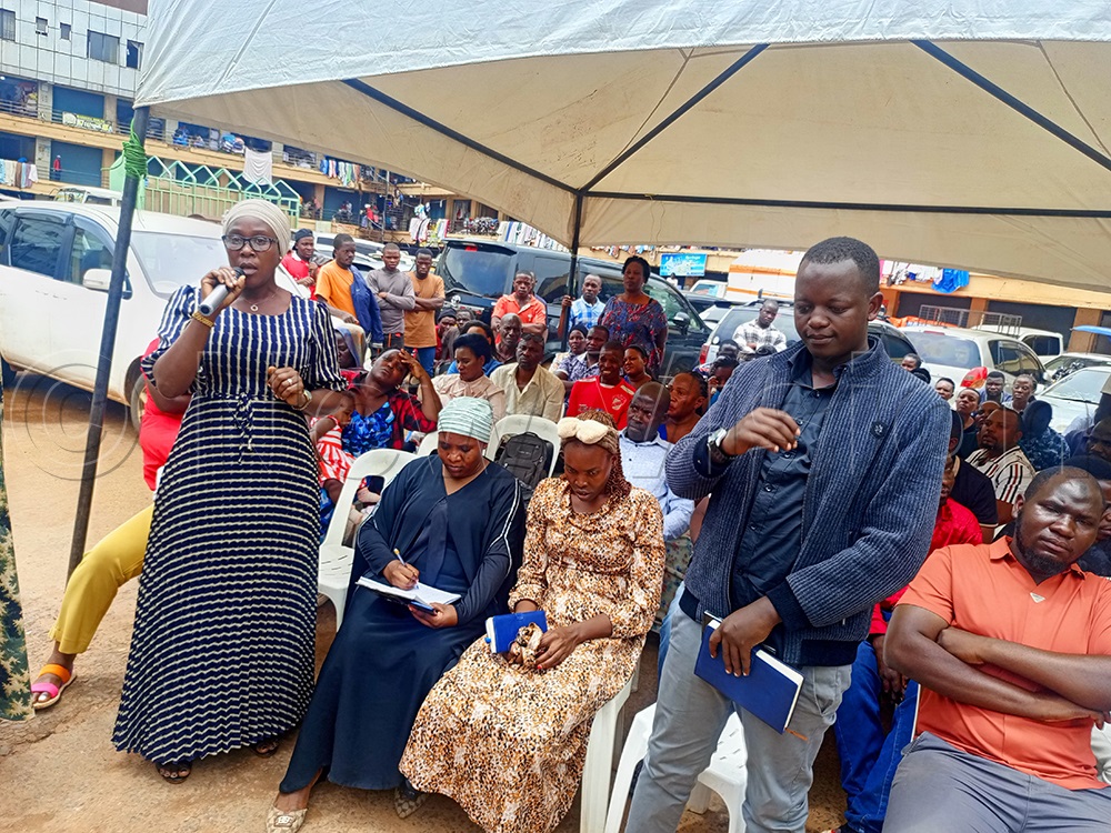 Some of the traders highlighting their concerns during the meeting. (Credit: Moses Kigongo)