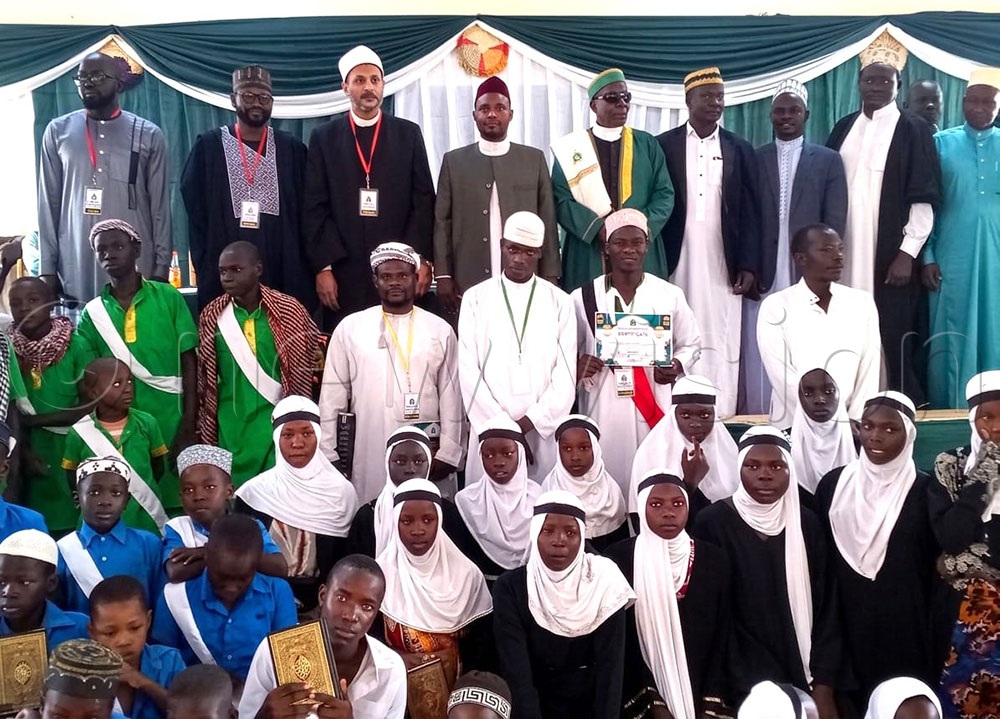 Muslim leaders in Teso and Karamoja sub-regions, led by Regional Assistant to the Mufti Sheikh Obilan (4th left) and adjudicators of the Quran competition, take a group photo with winners in the region. (Credit: Delux Emmy Alomu)