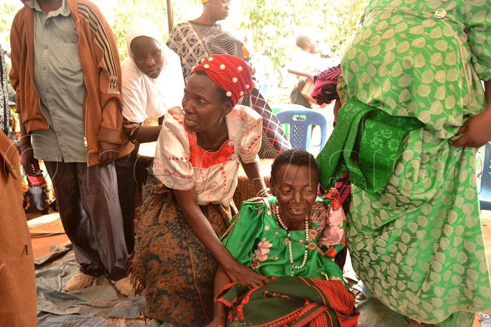 Tamale's mother grieving the death of his son. (Photo by Margret Zalwango)
