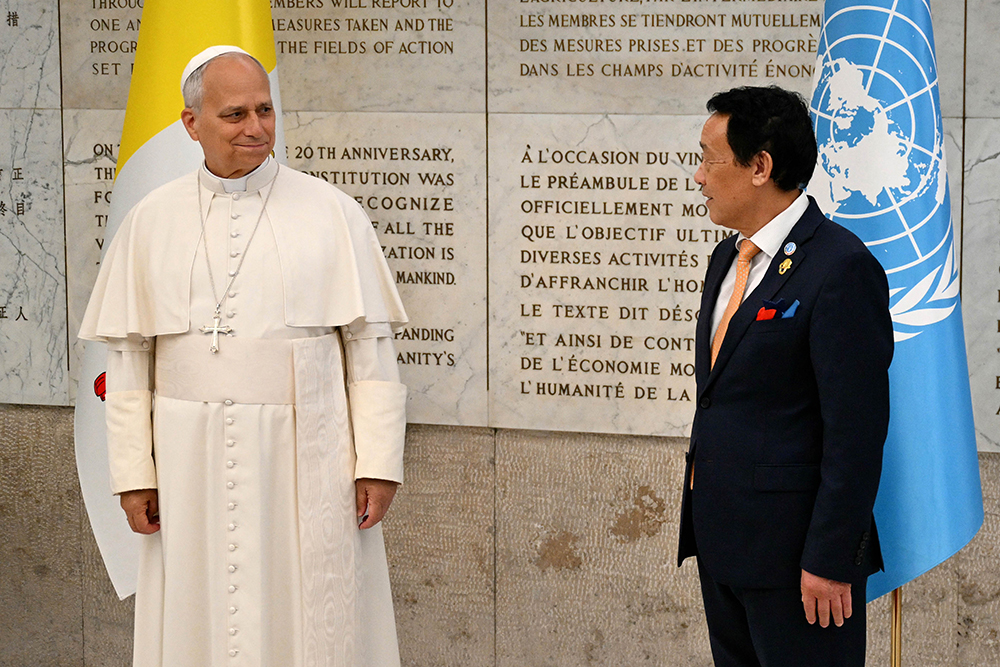 FAO Director-General Qu Dongyu welcomes Pope Leo XIV at the World Food Day ceremony at the Food and Agriculture Organization of the United Nations (FAO) headquarters in Rome on October 16, 2025.