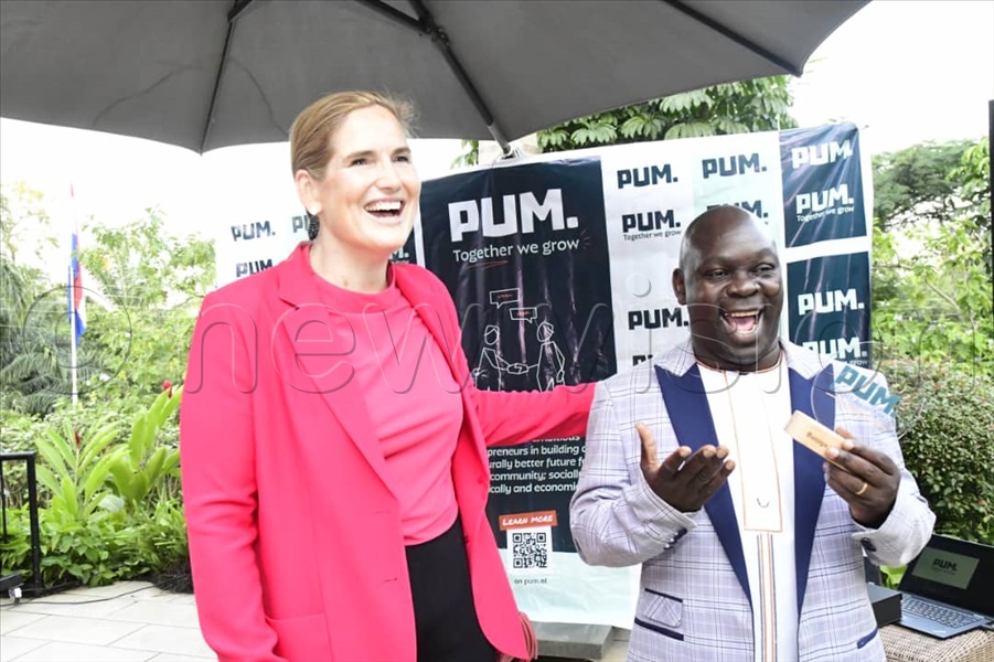 Netherlands ambassador to Uganda Frederieke Quispel and Moses Kyangwa, the founder of Busoga Health Forum, who won this year's Professional People for Positive Impact (PUM) best performance award.