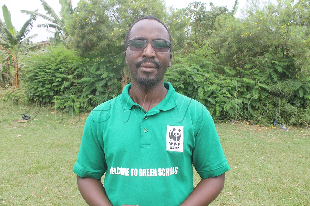 Ali Happy, the WWF communications officer saying that they intend to engage young people to be at the front of the environment conservation efforts since climate change effect could cripple them in future. (Photo by Samuel Amanyire)