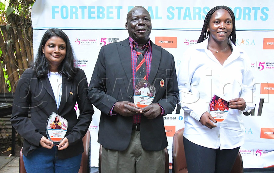 From the left is Sana Omprakash, legend John Oduke and Shadia Nassanga of netball. Photo: Silvano Kibuuka