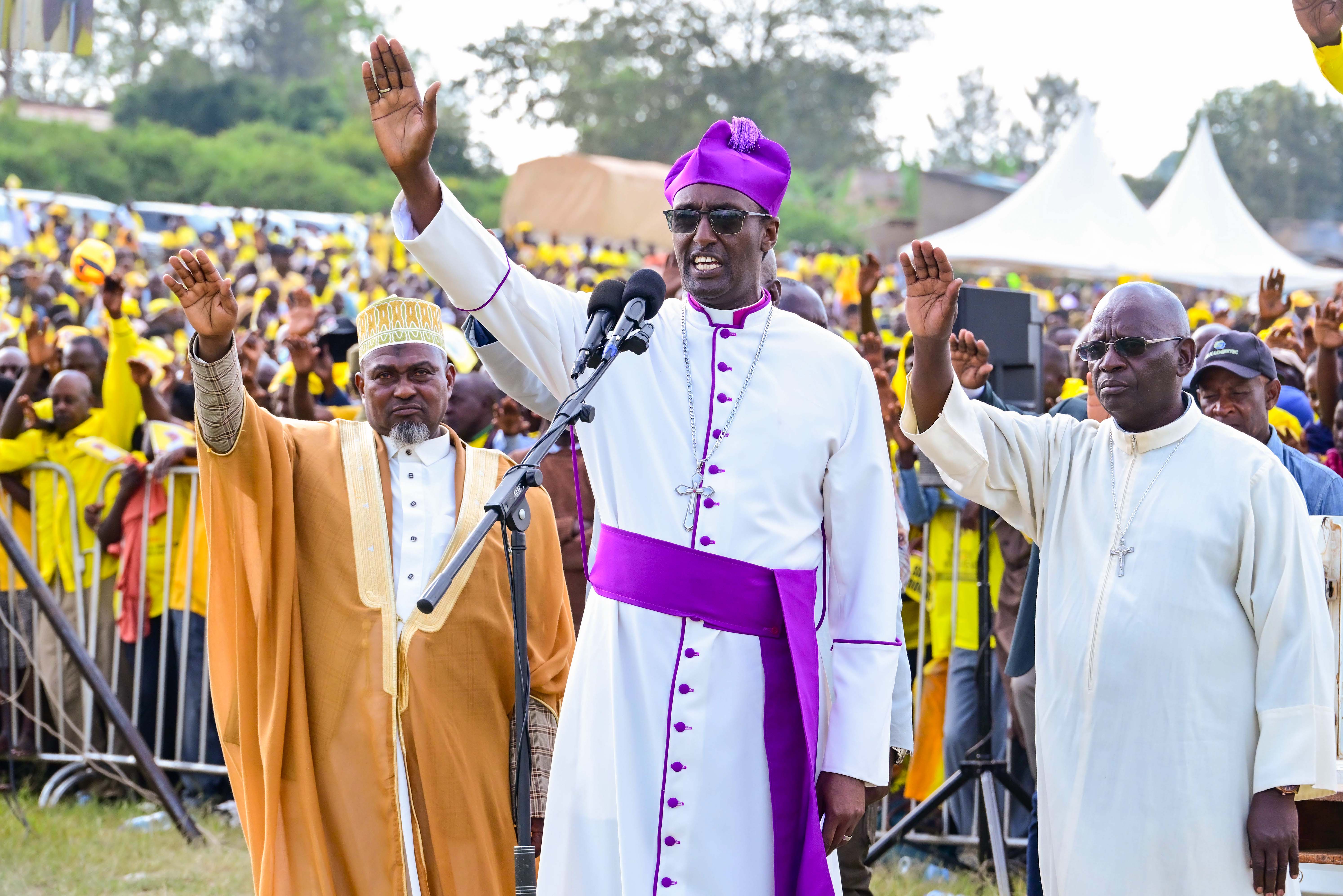 Bishop of North Ankole Diocese Alfred Muhoozi  and other clergy leading prayers during President Museveni's campaign rally at Nyakasharara play grounds in Kiruhura district on Friday.