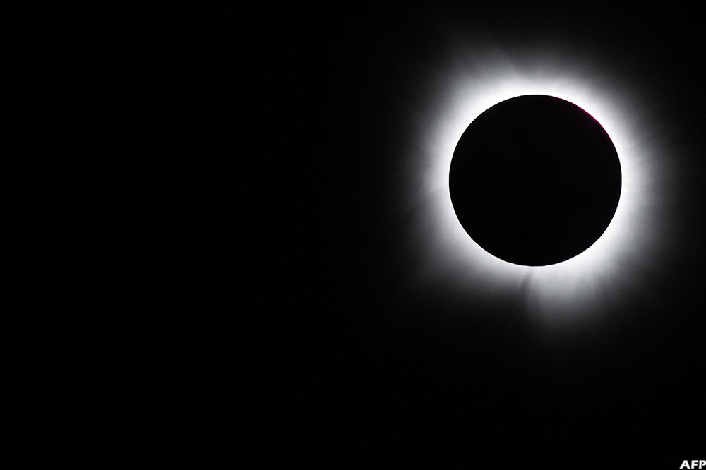 Eclipses happen when the Moon passes directly between the Sun and Earth, casting a narrow band of shadow across our planet