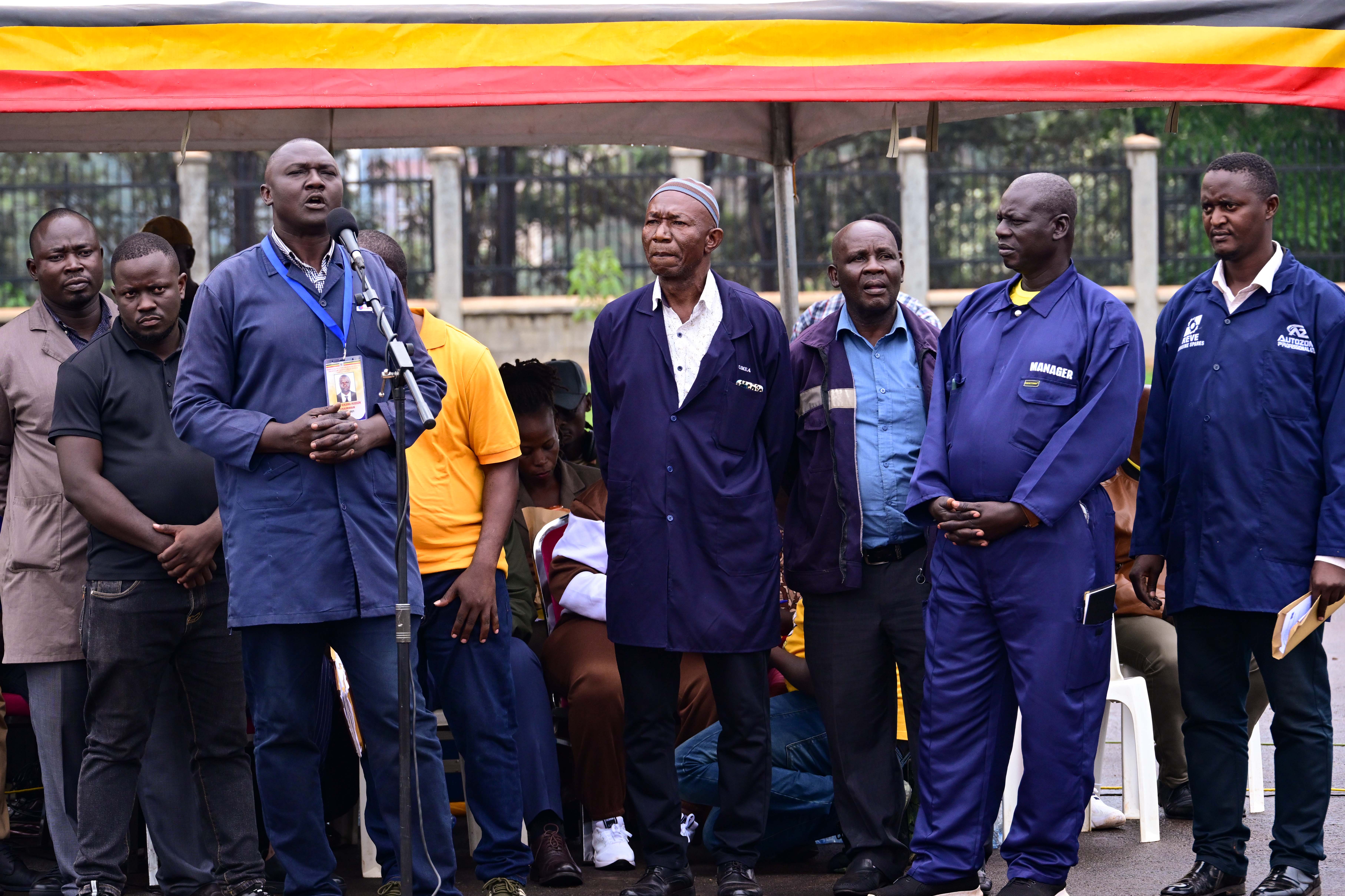 Some leaders of the mechanics and garage operators from Kampala metropolitan region express their support for President Museveni during a meeting at Kololo on Sunday. 