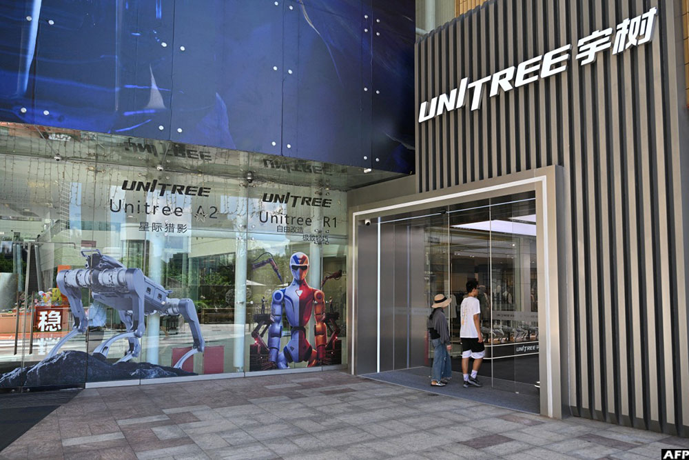 People visit the Unitree Robotics Embodied Intelligence Experience Center in the Jing'an district in Shanghai. (AFP)