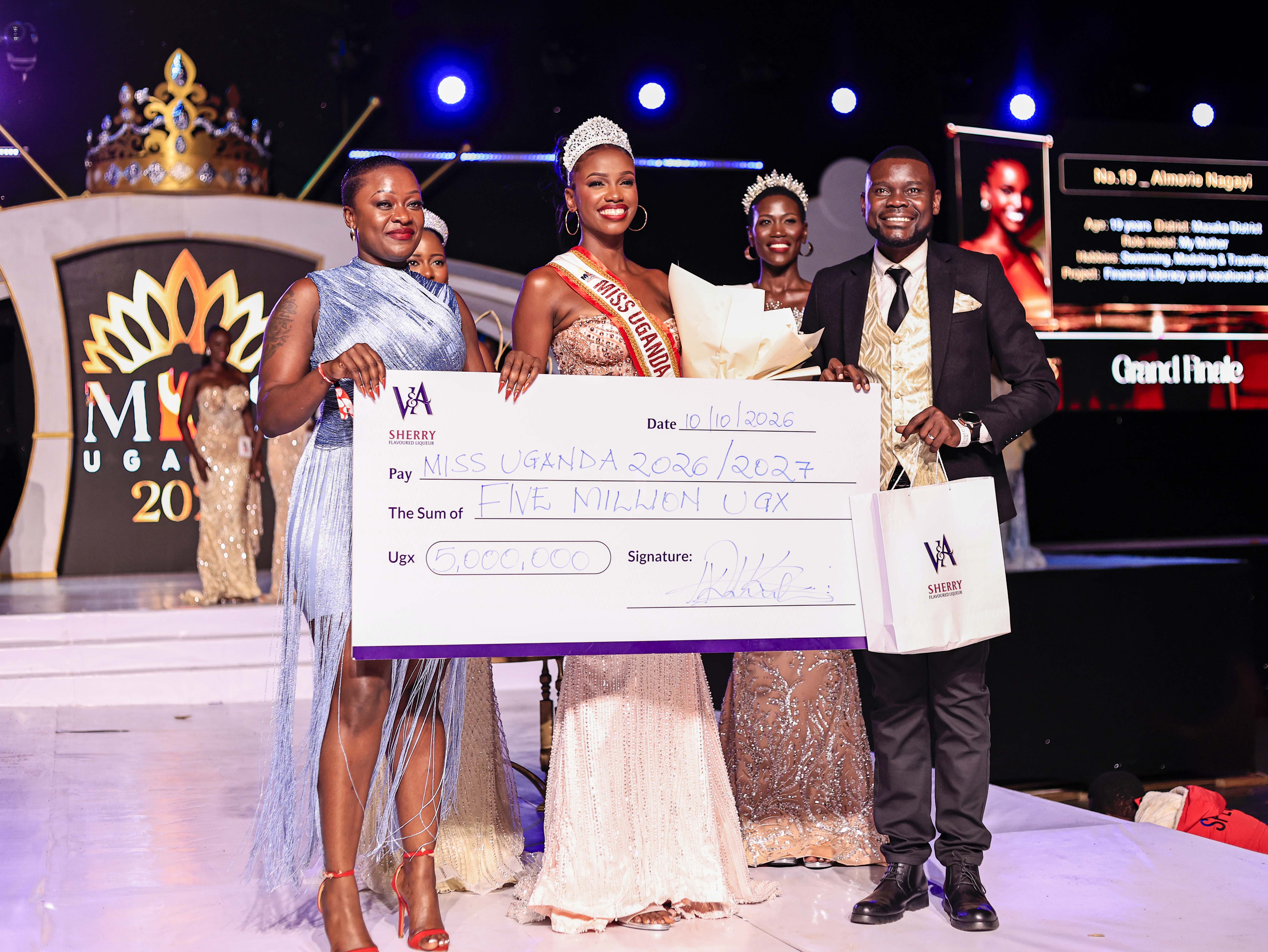 V&a Gifted Almorie Nagayi With A Cheque Of 5 Million Ugandan Shillings. Photo By Ignatius Kamya