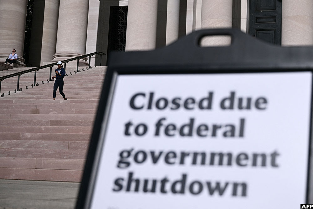 People enjoy the weather at the closed National Gallery of Art in Washington, DC, on October 20, 2025