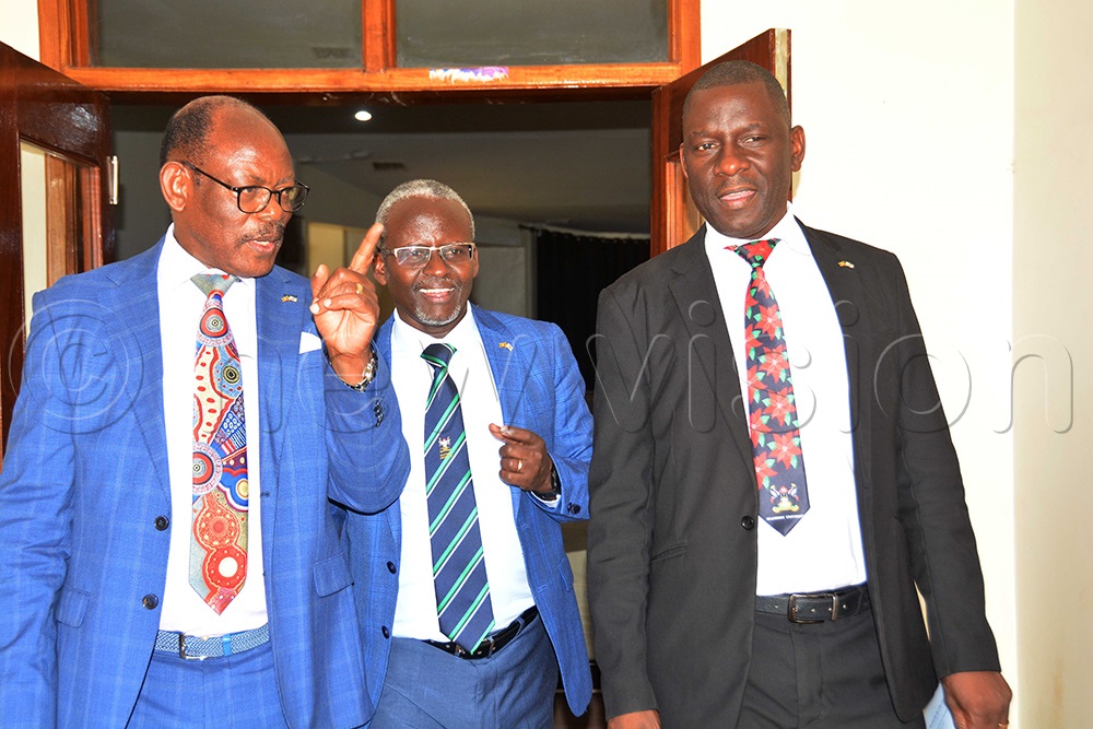 L-R: The Vice Chancellor of Makerere University Prof. Barnabas Nawangwe, Prof. William Tayebwa Associate Prof. Julius Kikooma interacting after the opening of research dissemination workshop at School of Food Science conference hall in Makerere University on July 31, 2025. (Photo by Francis Emorut)