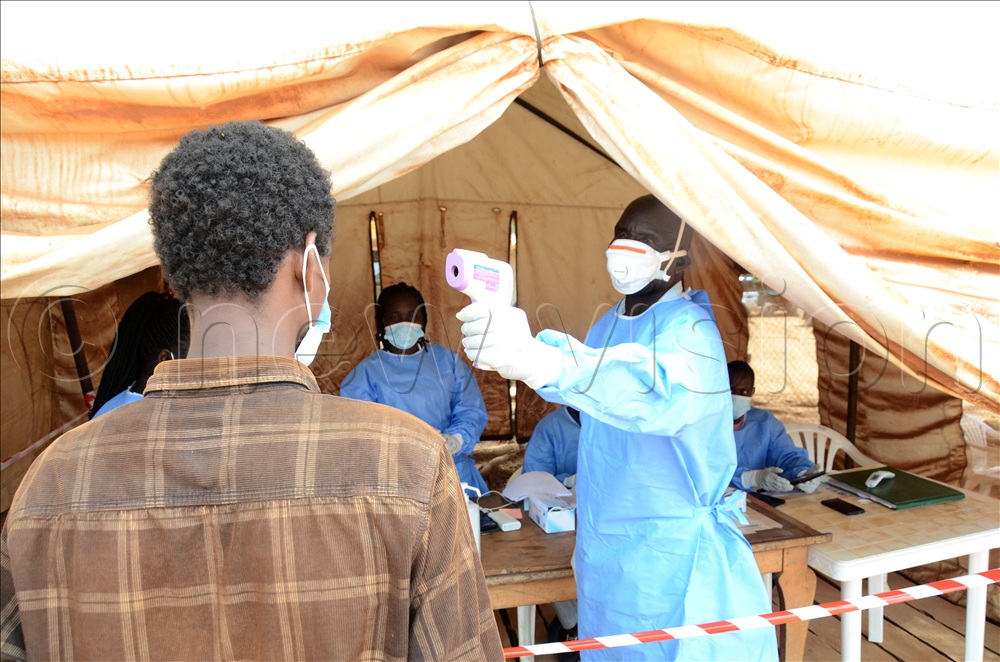 A track driver crossing from Congo to Uganda at the Vurra border post in Arua district being screened with a temperature gun by a medical officer at the Vurra Point of Entry. The government has intensified surveillance and screening at Uganda's border points with the Democratic Republic of Congo (DRC) as part of efforts to prevent the spread of the Ebola Bundibugyo virus. This was on June 6, 2026.