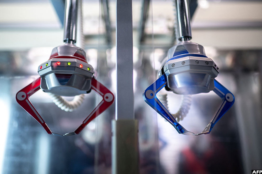 A section of the "New UFO Catcher" claw crane game machine at Japanese video game and entertainment company Sega's booth during the Amusement Expo 2025 in Tokyo. (AFP)