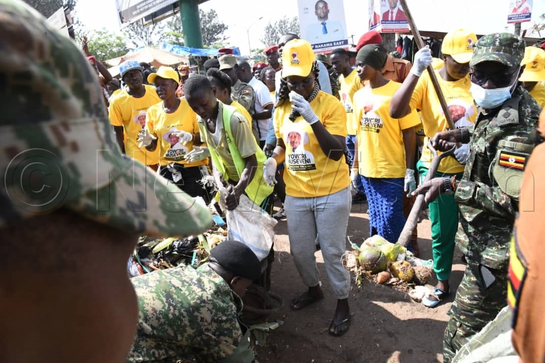 UPDF, Uganda Prisons Service and Uganda Police Force joined by their spouses and children as they cleaned Nakawa market.