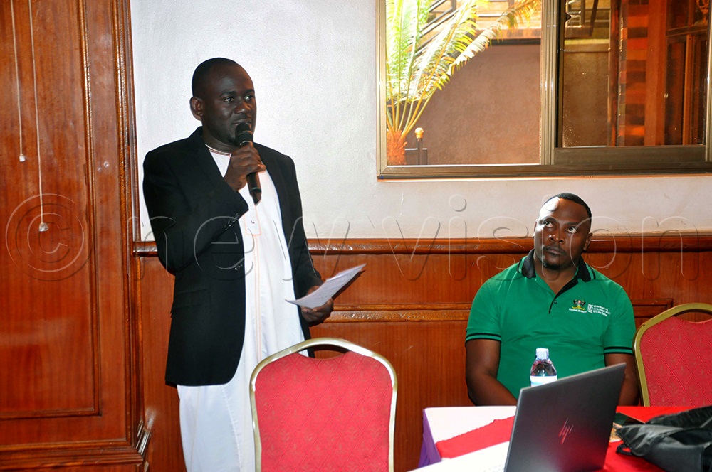 Dr. Peter Babyenda, lecturer at the School of Economics, Makerere University, addressing participants during the release of the study at Tick Hotel in Kawempe Division, Kampala. (Photo by John Odyek)
