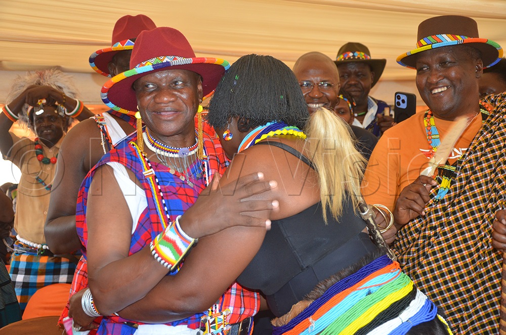 Sharon embraces Pulkol during the modified traditional marriage. (Photo by Olandason Wanyama). (Photo by Olandason Wanyama)