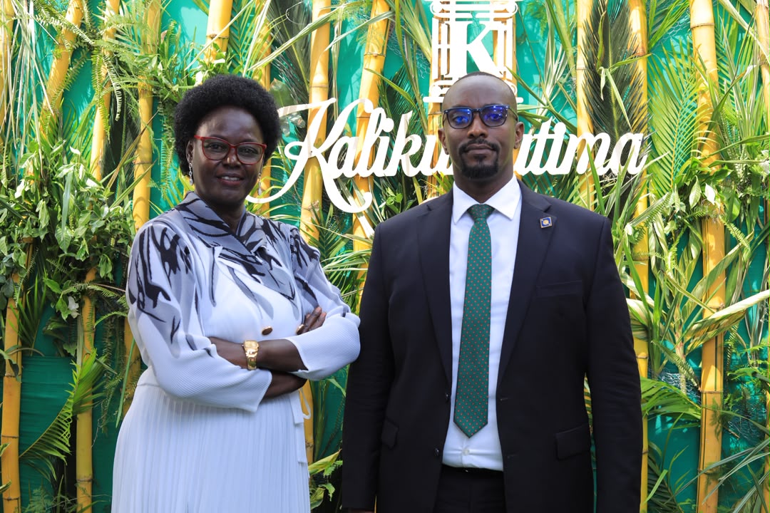 L-R; Counsel Deo Kalikumutima, Chief Executive Partner, Kalikumutima and Co Advocates during the 10th anniversary celebration with one of the guests at the event