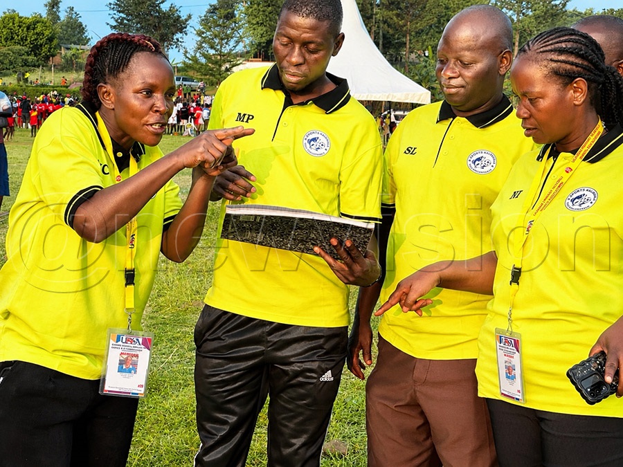 Kalangala district team officials having a pep talk ahead of their games
