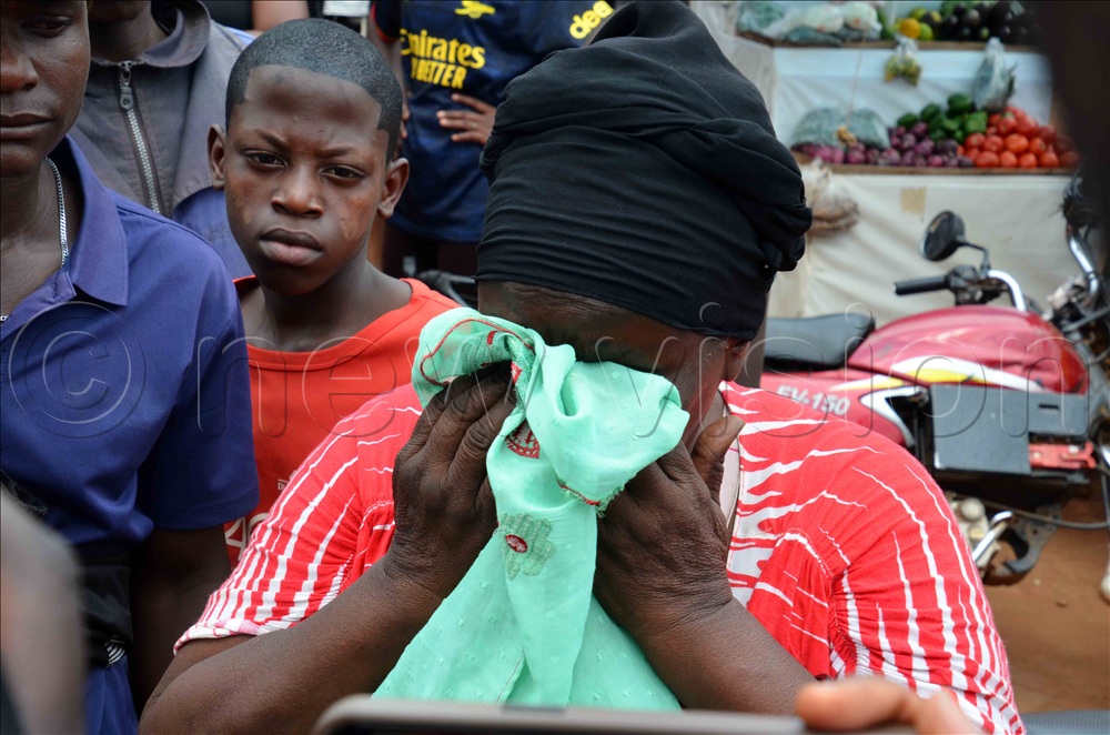 An old woman wept over Moses Matovu's murder. (Photo by Stuart Yiga) 