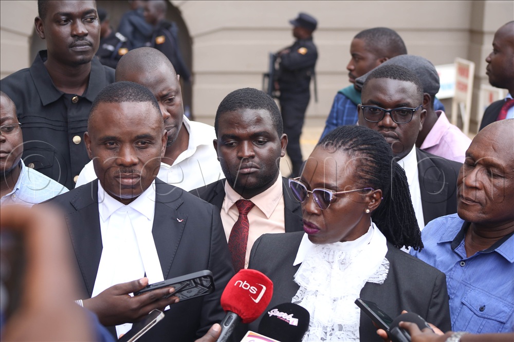 Erias Lukwago, Martha Karua and other lawyers speacking to journalists after court session held on March 12, in High Court Kampala. 