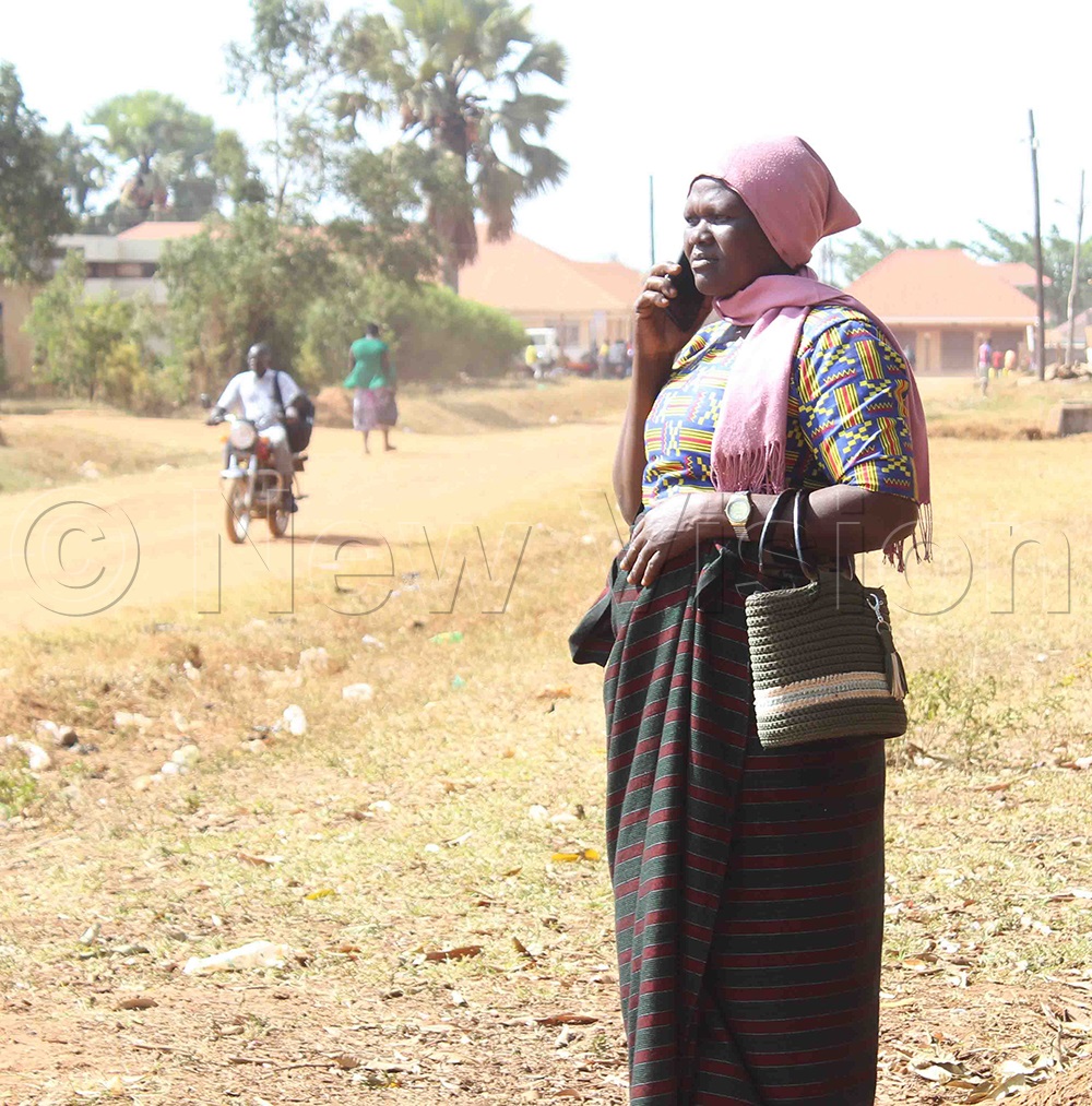 Caronine Ajumo, one of the candidates for female district workers councilor for Kaberamaido, as she made a call.