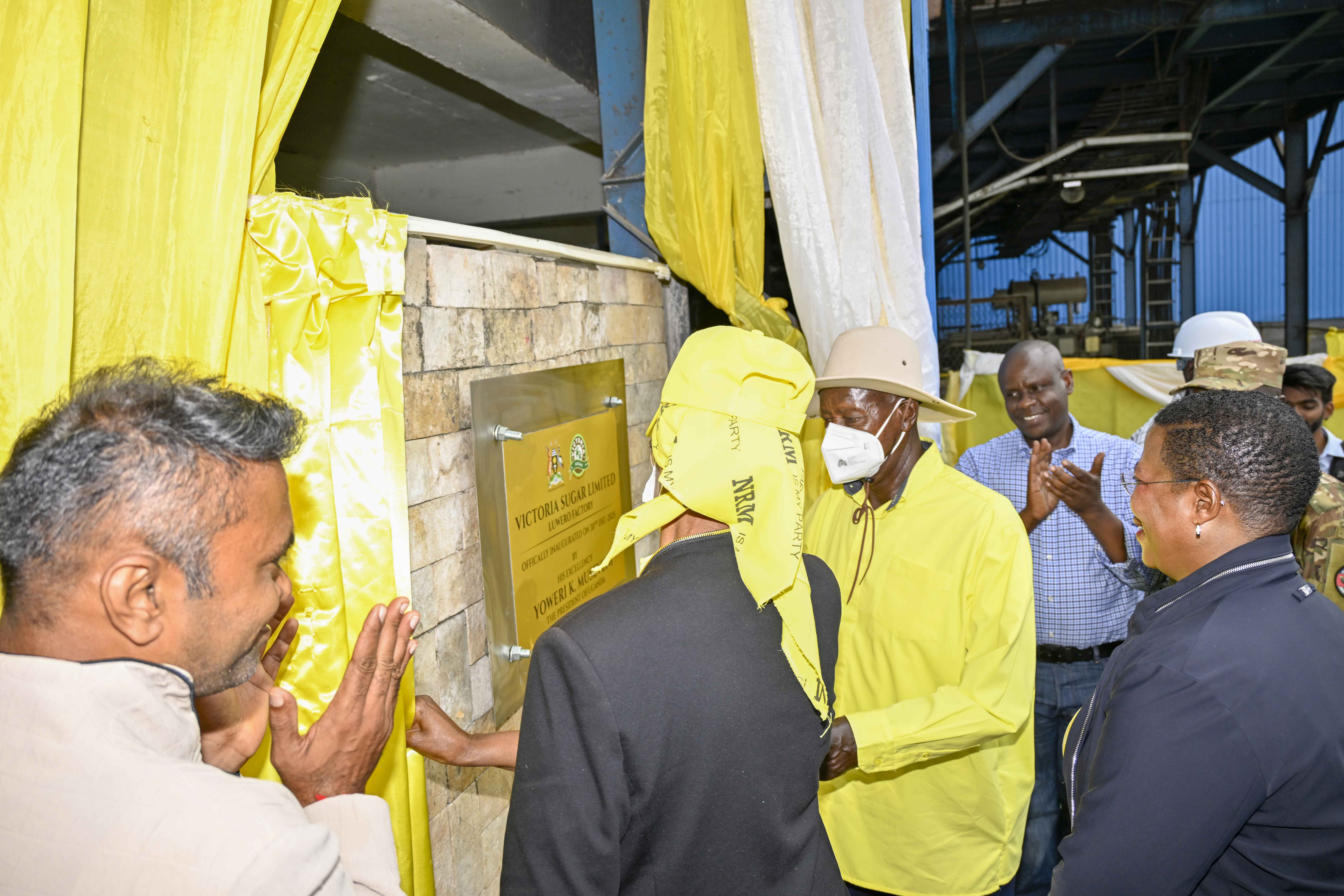President Yoweri Kaguta Museveni, accompanied by the First Lady Janet Kataha Museveni, the Speaker of Parliament Rt. Hon. Anita Annet Among and Victoria Sugar Limited, Luwero Factory managing director Jiyani Alpesh unveiling a plague as a sign of official Inauguration of Victoria Sugar Limited Luwero Factory.