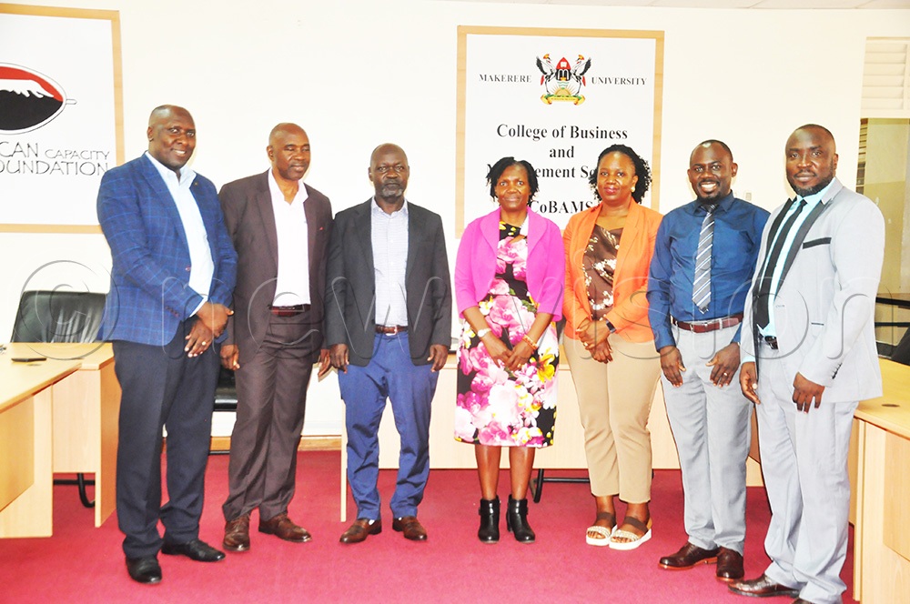 R-L: Ekudu, Babyenda, Nabirye and Bbaale (First left) and other lecturers pose for a photo during an inception meeting for the study held at the College of Business and Management Studies (COBAMS), Makerere University, Kampala. (Photo by John Odyek)