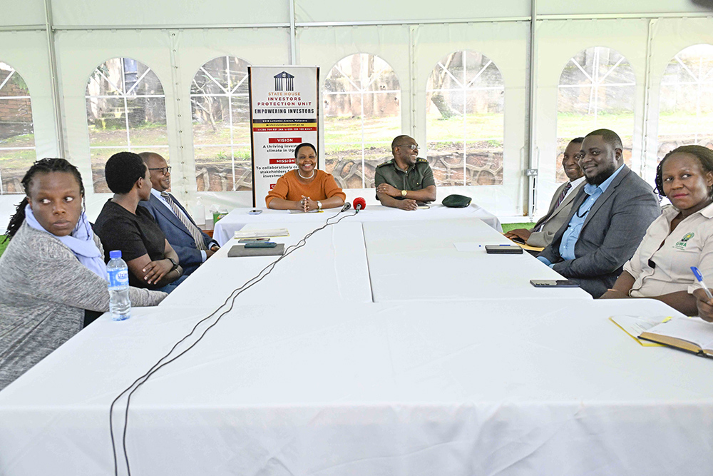  Head of the State House Investors Protection Unit (SHIPU) Col. Edith Nakalema and the Director Biodiversity Management at Uganda Wildlife Authority (UWA) John Makombo in a meeting where the SHIPU head Intervened in an extortion case involving an UWA staff. (Photo by Tony Rujuta)