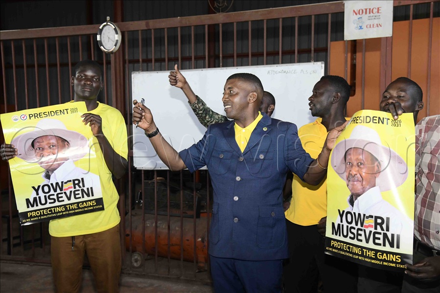 Ssewava showing trainees campaign posters of President Yoweri Museveni.