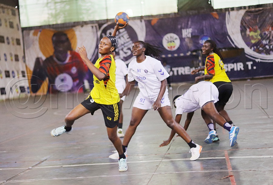 A Kyengeza player with the ball attacks the Police defence during their league game on Sunday. Police won 55–38. PHOTO: Johnson Were
