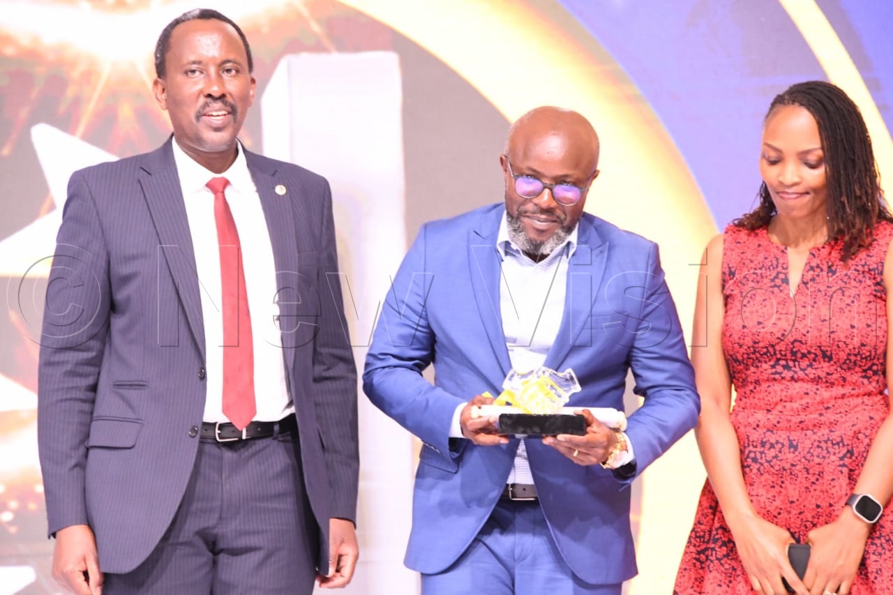 Don Wanyama (centre), Vision Group’s CEO, who picked the award, expressed his appreciation to URA for its tax mobilisation efforts, as well as the recognition. (Credit: Mpalanyi Ssentongo)