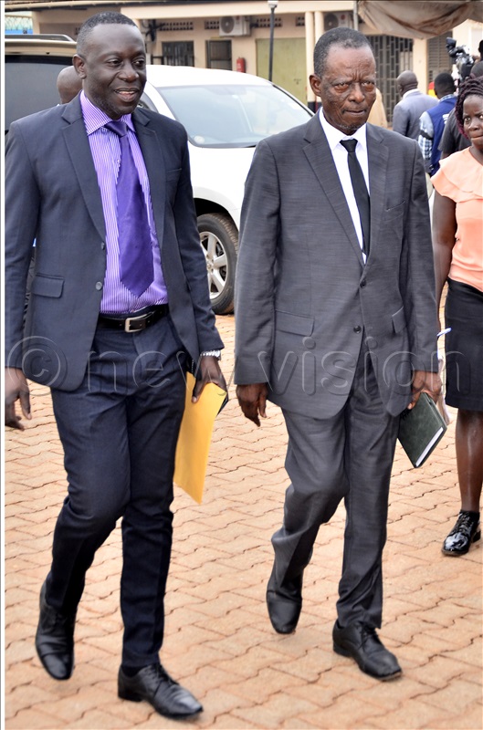 An aspiring presidential candidate, Mabirizi Alton Joseph (left) arrive to Electoral Commission officers in Kampala to pick nomination forms accompanied by Kenn Lukyamizi of Conservative during pick of forms for presidential candidates at Electoral Commission offices in Kampala on 11 Aug 2025.