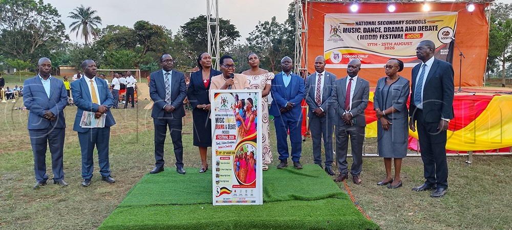 Juliet Muzora Atuhaire, flanked by members of the national organising committee, addresses participants during the festival on Friday. (Photo by Faustine Odeke)