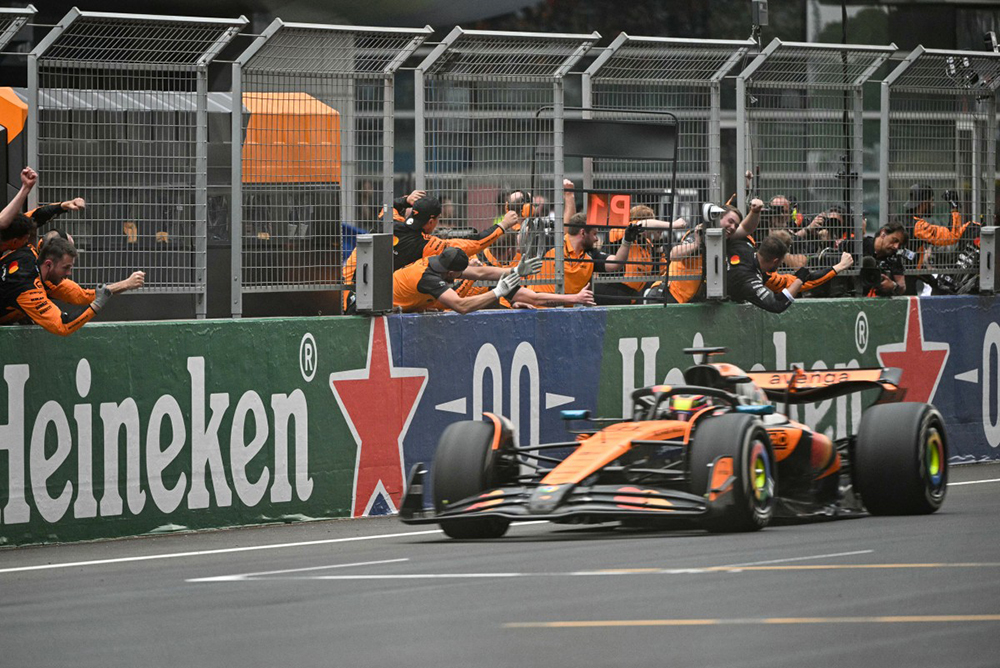 Team members celebrate the victory of McLaren's Australian driver Oscar Piastri during the Formula One Chinese Grand Prix at the Shanghai International Circuit in Shanghai on March 23, 2025. 