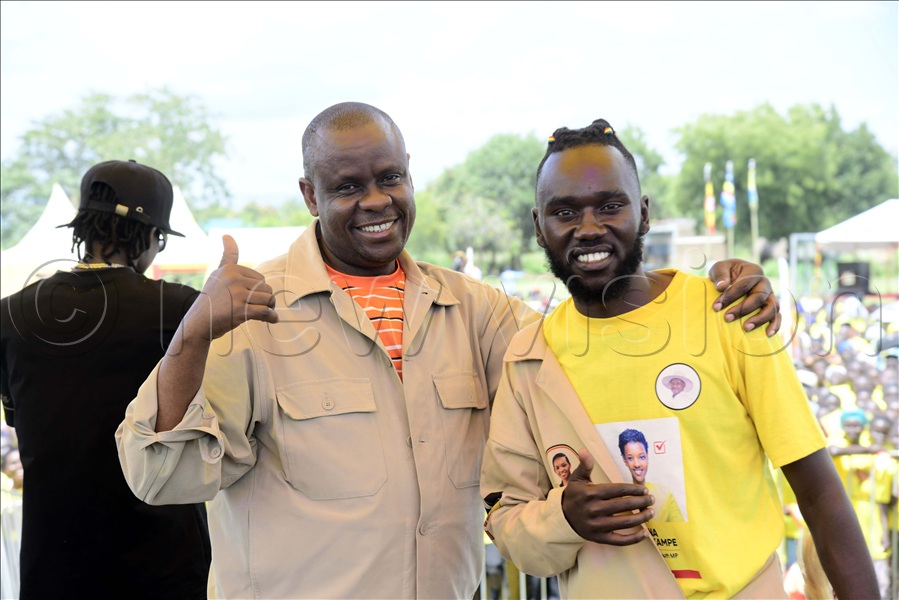 Minister Balaam Barugahara with a local musician in Nebbi.