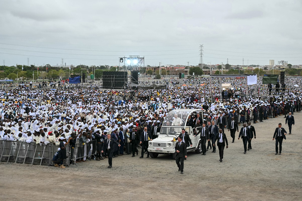 Pope Leo XIV (C) arrives in the Popemobile to lead a Holy Mass in Kilamba on the seventh day of an 11-day apostolic journey to Africa, on April 19, 2026. 