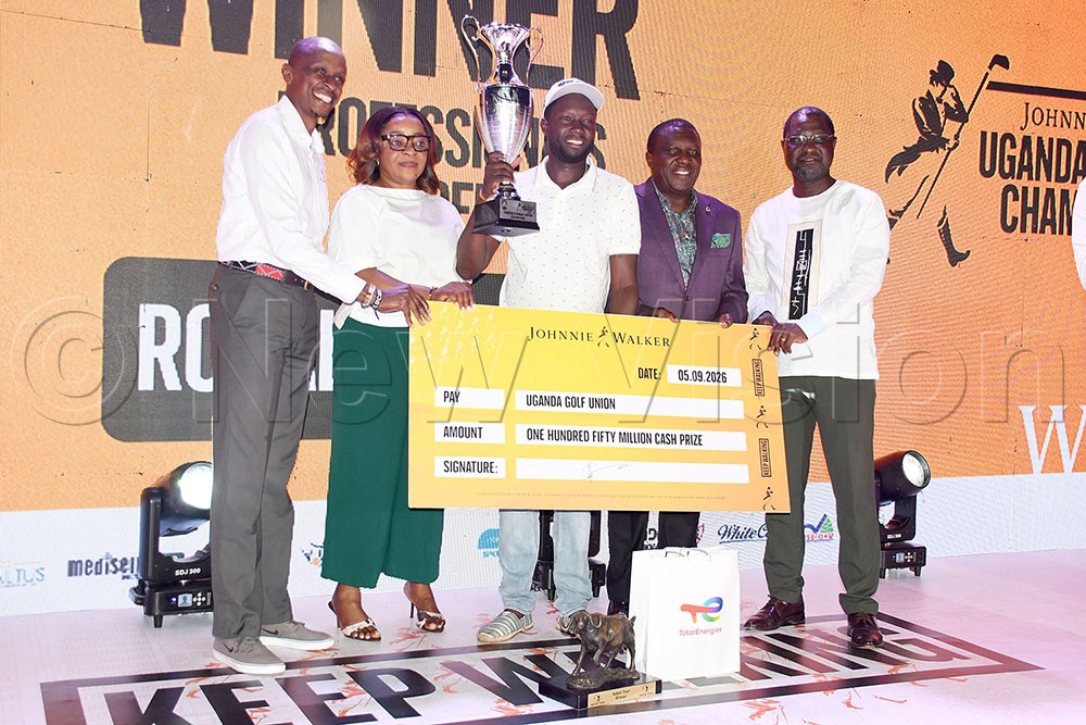 UBL Managing Director Felicite Nson (2nd left) and UBL Board Chairman Jimmy Mugerwa (2nd right) and UGU president Jackson Were (right) and a Safari Tour representative present prizes to Ronald Rugumayo after the Johnnie Walker Uganda Golf Open Championship at Kitante, September 5, 2026. (Credit: Michael Nsubuga)